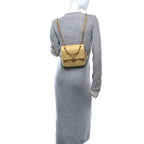 Shiny Caviar Quilted Chain Melody Backpack Yellow