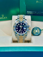 ROLEX GMT-Master II Black Dial Steel 18kt Yellow Gold