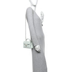 Caviar Quilted Retro Twist Top Handle Clutch Light Green